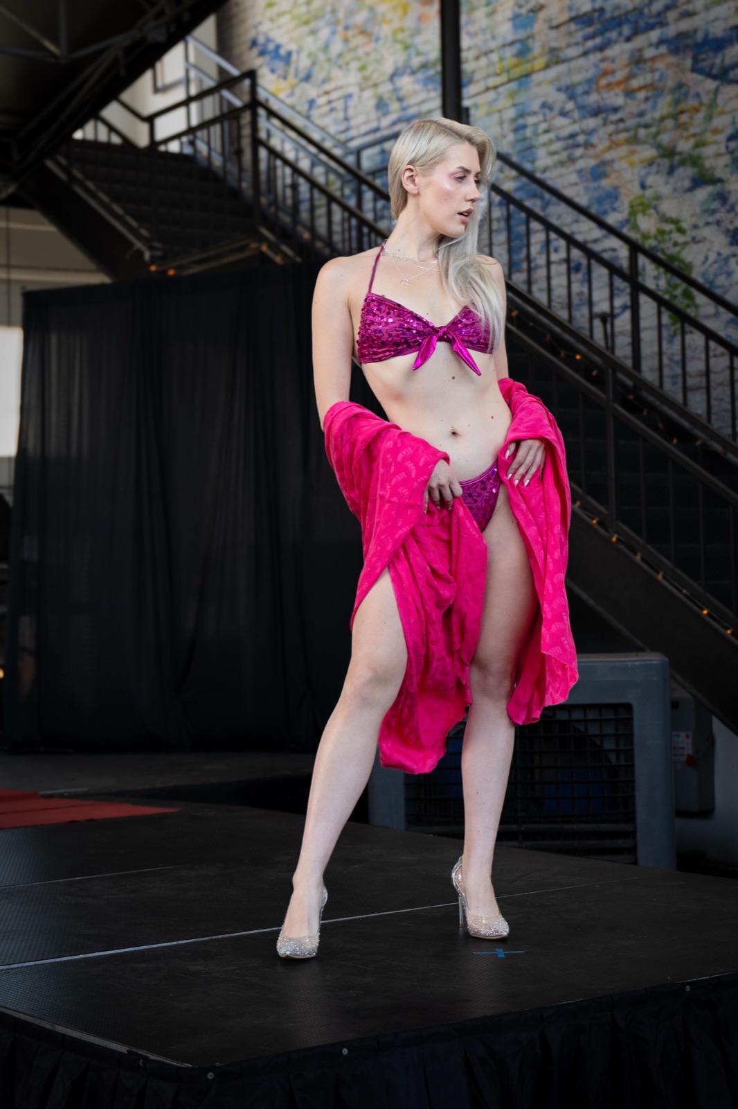 Ida Angelma at the Rebel Wrld Fashion Show in a pink sequined bikini and sheer wrap